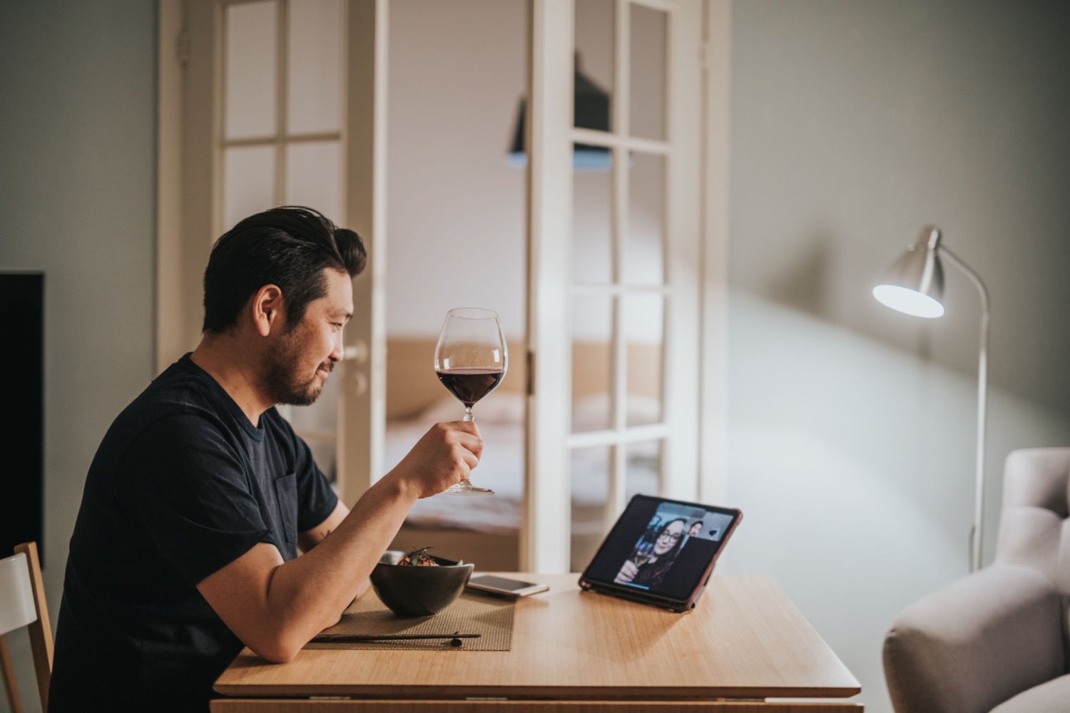 Japanese man drinks wine with his girlfriend over video call virtual dinner